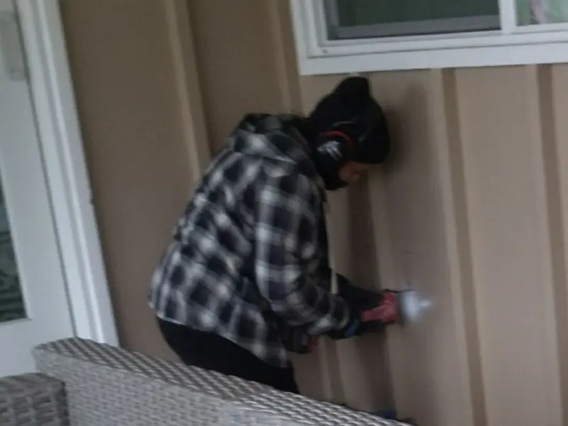 Professional electrician installing an exterior outlet in Middlefield